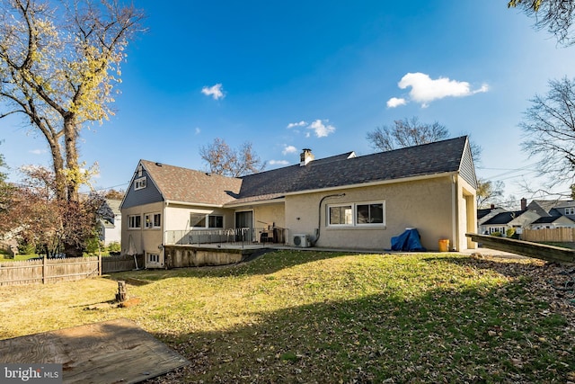 back of property with a lawn