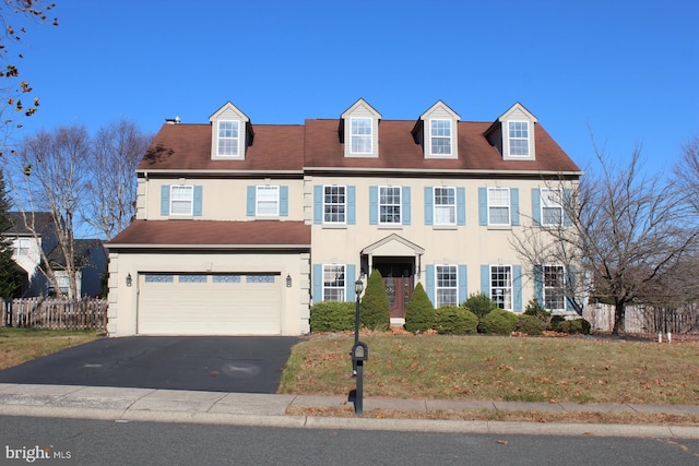 view of front facade featuring a garage and a front lawn