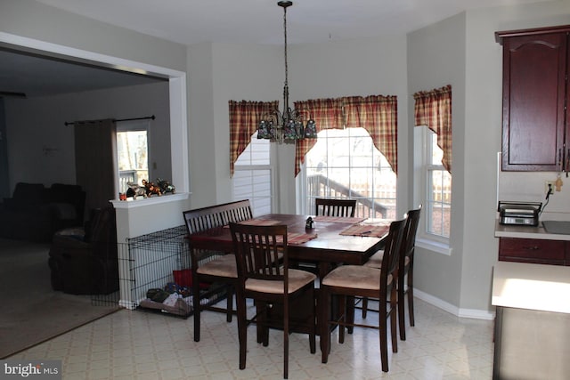 dining area featuring an inviting chandelier