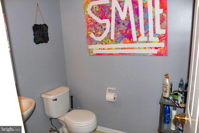 bathroom featuring sink and toilet