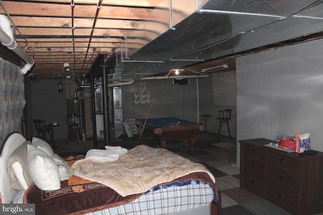 bedroom featuring gas water heater and pool table