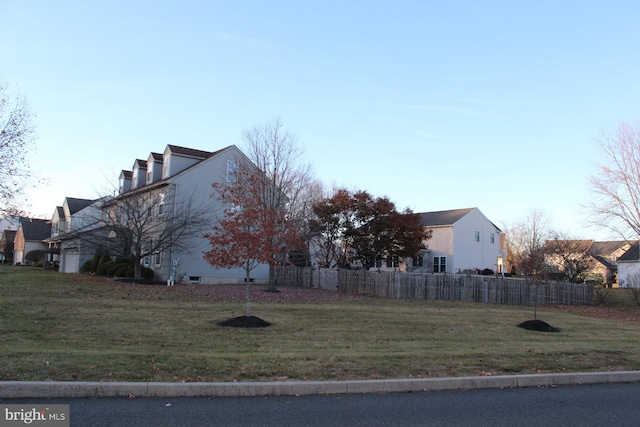 view of side of property featuring a yard