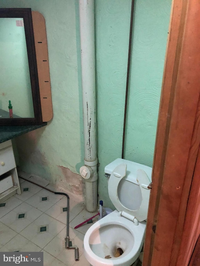 bathroom featuring toilet and tile patterned floors