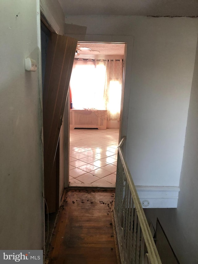 hallway with wood-type flooring