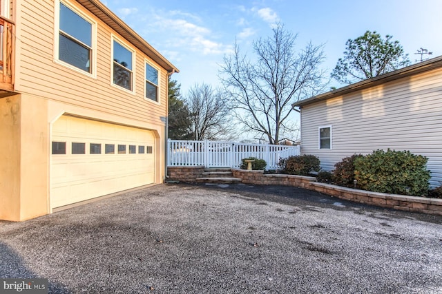 view of side of home with a garage