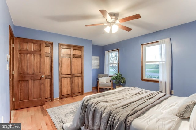 bedroom featuring light hardwood / wood-style flooring and ceiling fan