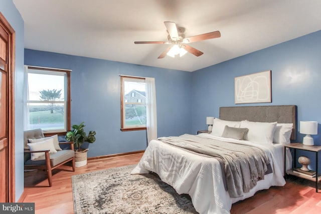 bedroom featuring ceiling fan and hardwood / wood-style flooring