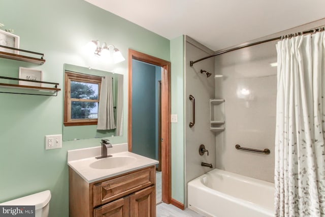 full bathroom featuring shower / bath combo, toilet, and vanity