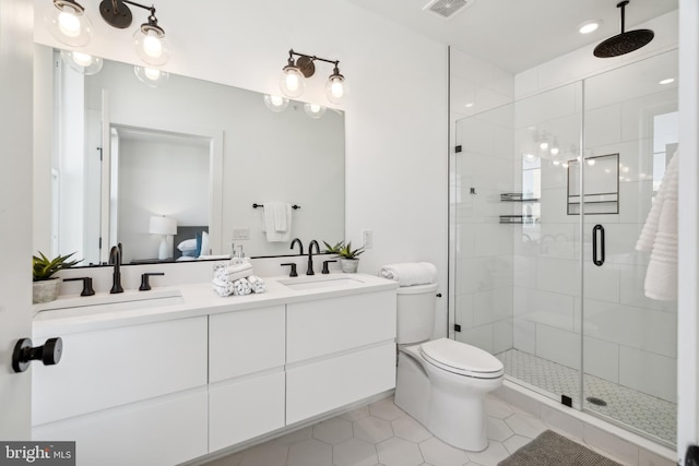 1513 Christian St Unit 5, Philadelphia, PA 19146 - full bathroom with tile patterned flooring, a stall shower, double vanity, and toilet