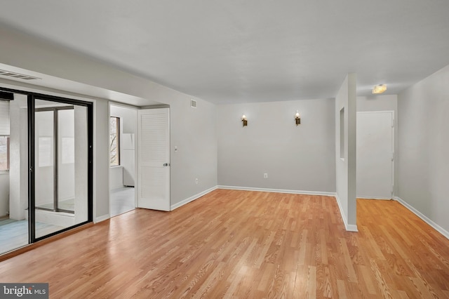 unfurnished room featuring light wood-type flooring