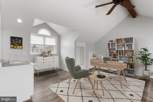 office featuring lofted ceiling with beams, sink, ceiling fan, and light hardwood / wood-style floors