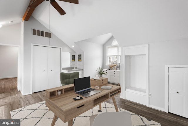 office area featuring ceiling fan, beamed ceiling, dark wood-type flooring, and high vaulted ceiling