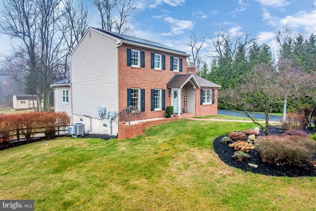 colonial inspired home with central AC and a front lawn