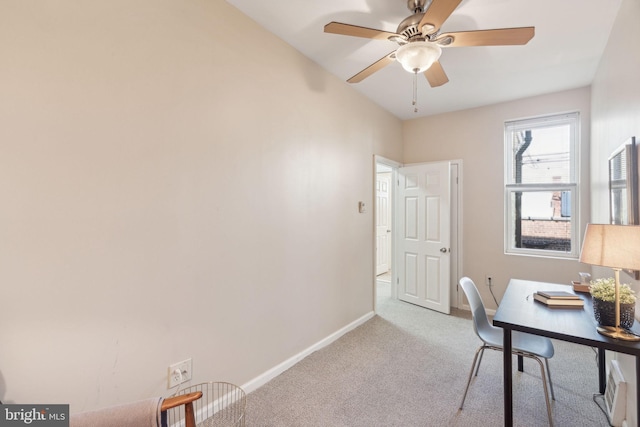 office featuring light carpet and ceiling fan