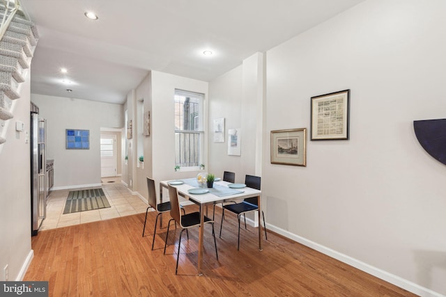 dining area featuring light wood-type flooring