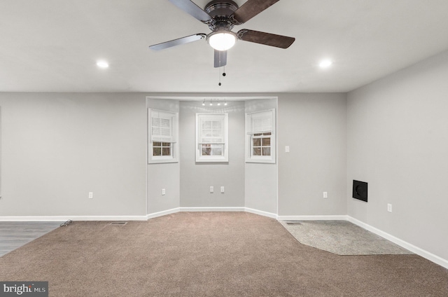 unfurnished room with ceiling fan and carpet floors