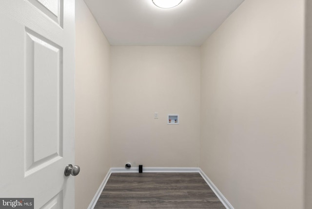 clothes washing area with hookup for a washing machine and dark hardwood / wood-style floors