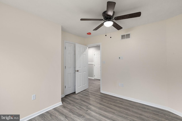 spare room with wood-type flooring and ceiling fan