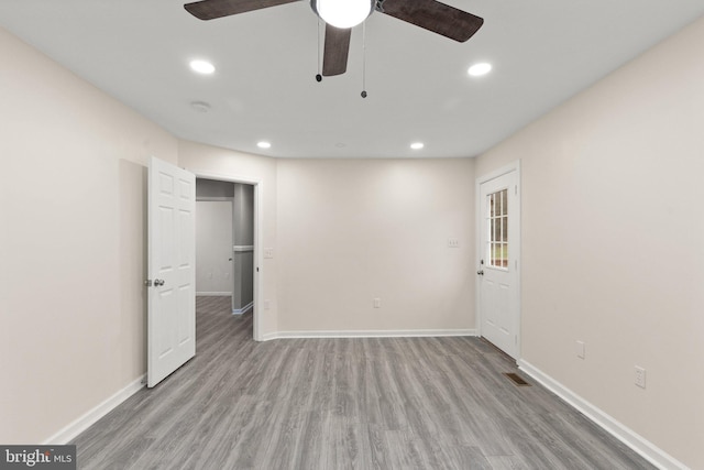 empty room featuring light hardwood / wood-style floors and ceiling fan