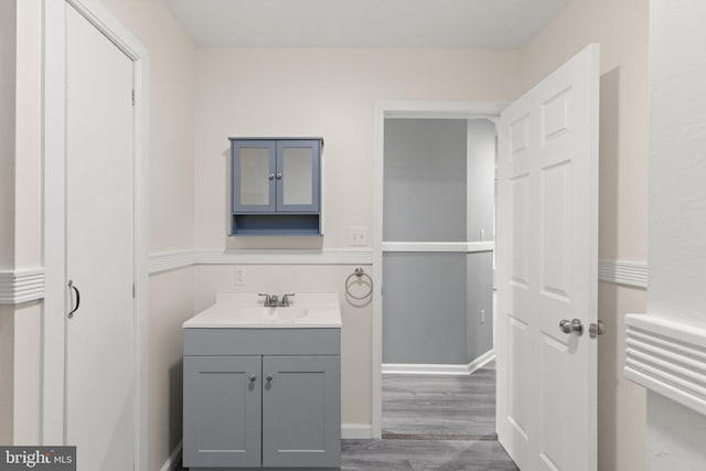 bathroom featuring vanity and wood-type flooring