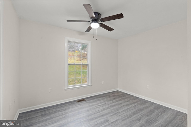 unfurnished room featuring ceiling fan and wood-type flooring