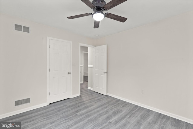 unfurnished bedroom featuring ceiling fan and light hardwood / wood-style floors