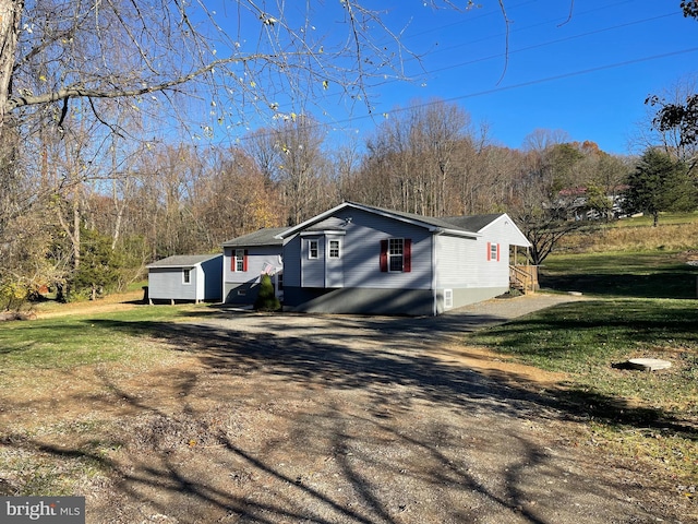 view of side of property with a yard