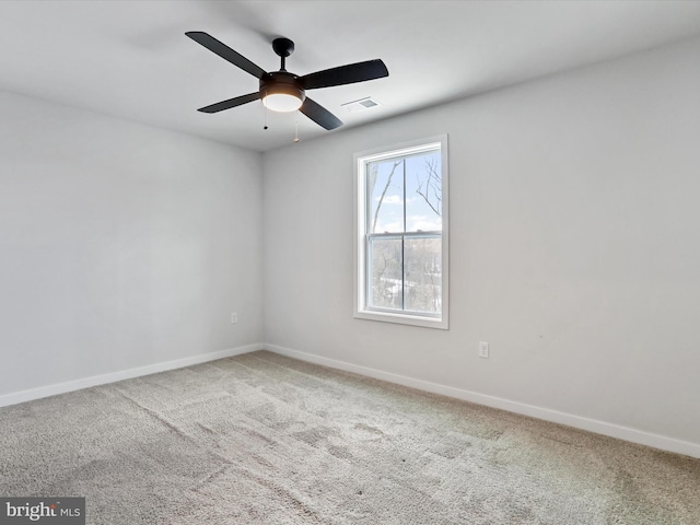 unfurnished room with ceiling fan and carpet floors