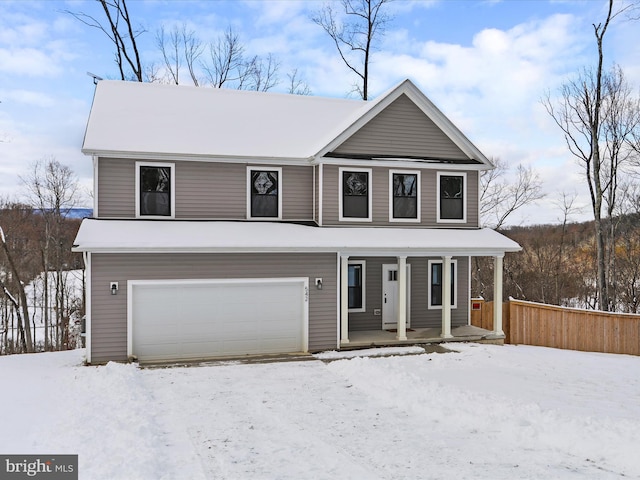 view of front of property with a garage and covered porch