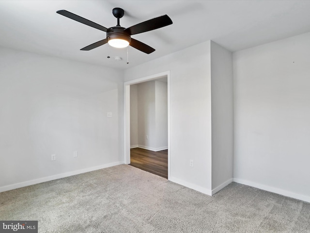 unfurnished room featuring ceiling fan and carpet floors