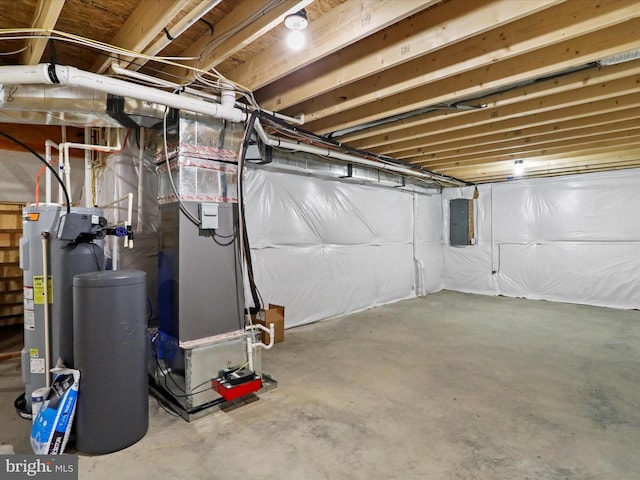 basement featuring electric panel and heating unit