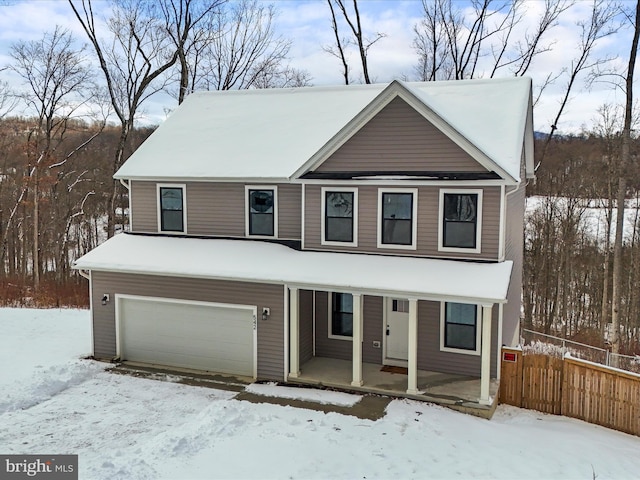 view of front of property featuring a porch and a garage