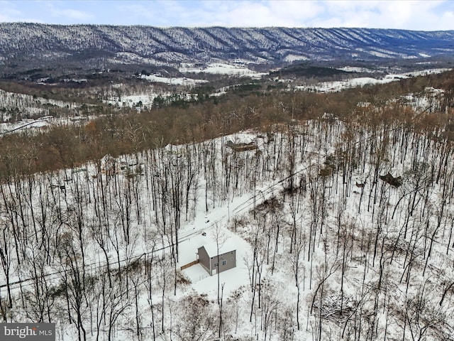 snowy aerial view with a mountain view