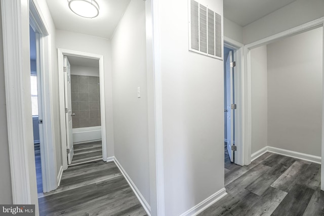 hall with dark hardwood / wood-style floors