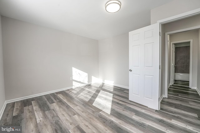 unfurnished room featuring dark hardwood / wood-style floors