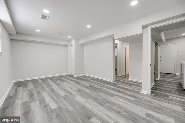 basement featuring light wood-type flooring