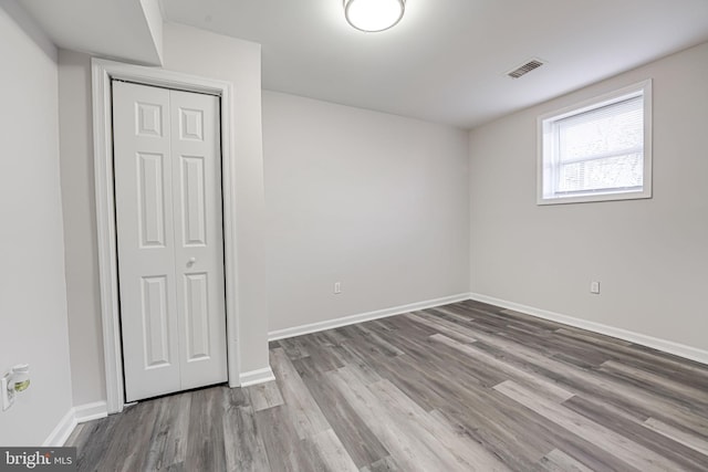 spare room featuring hardwood / wood-style floors