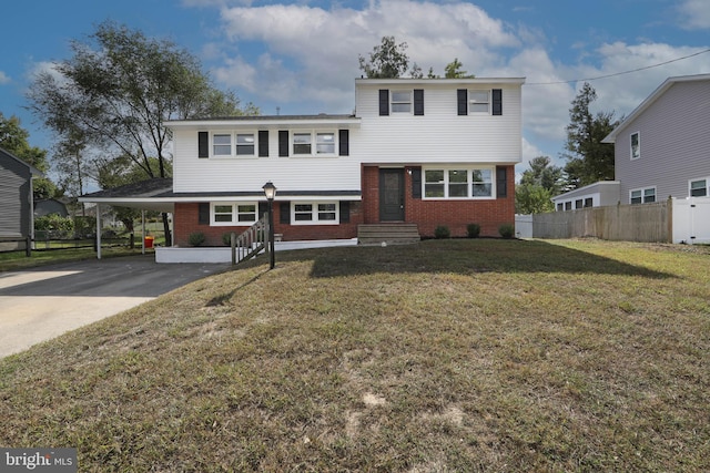 view of front of house with a front lawn and a carport