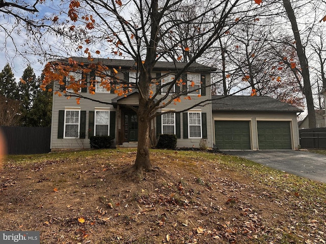 colonial home with a garage