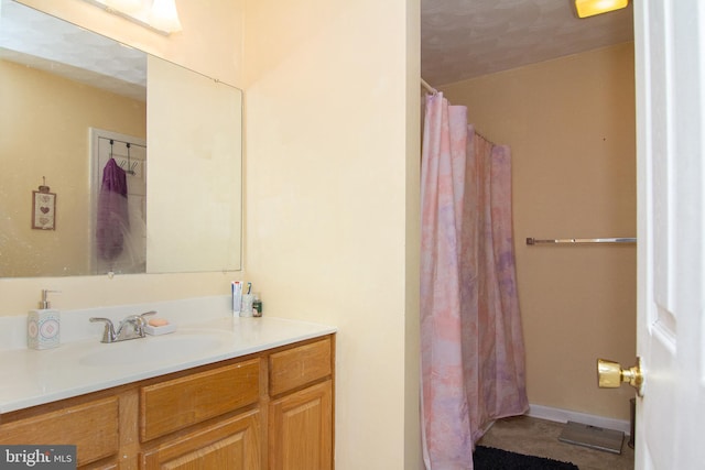 bathroom featuring vanity and walk in shower