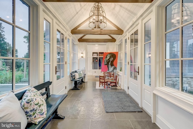 sunroom / solarium with vaulted ceiling with beams, french doors, wood ceiling, and an inviting chandelier