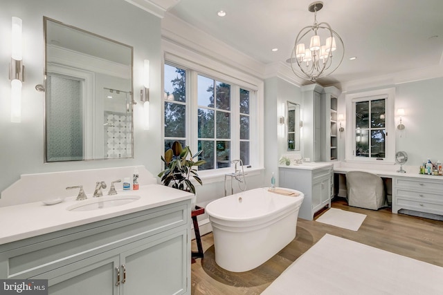 bathroom featuring ornamental molding, vanity, separate shower and tub, a notable chandelier, and hardwood / wood-style floors