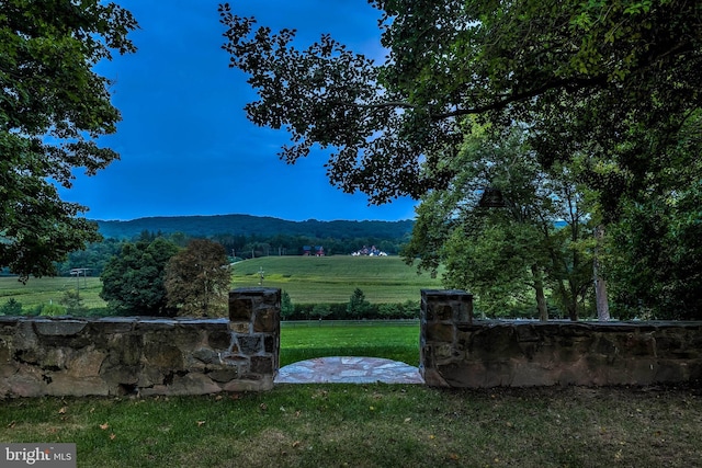 property view of mountains featuring a rural view