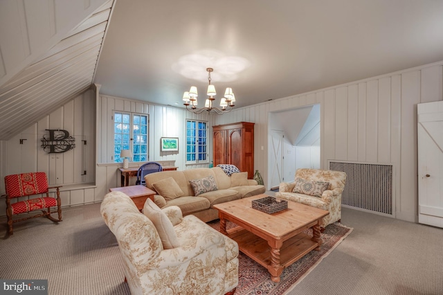 carpeted living room with a notable chandelier, wood walls, radiator heating unit, and vaulted ceiling