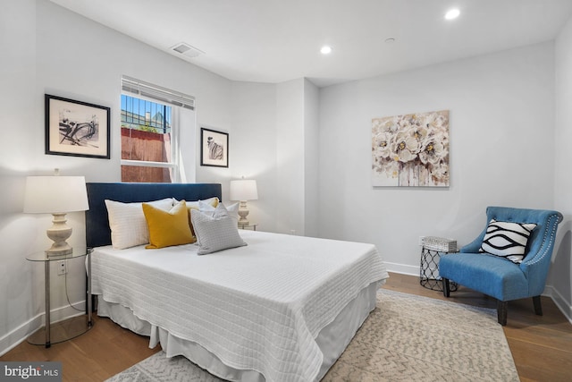 bedroom featuring hardwood / wood-style floors