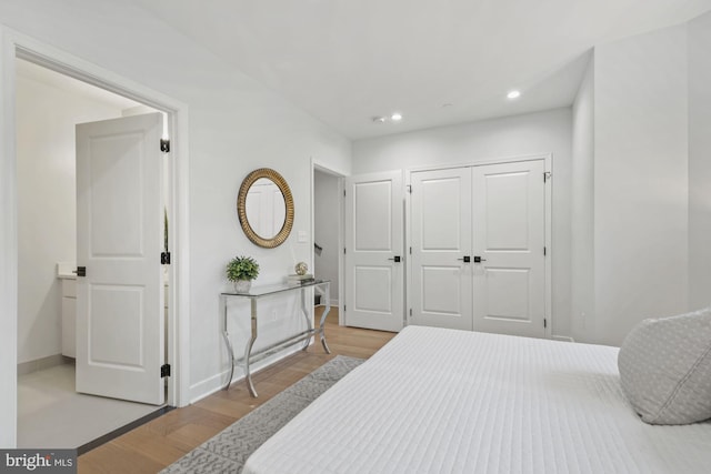 bedroom with light wood-type flooring