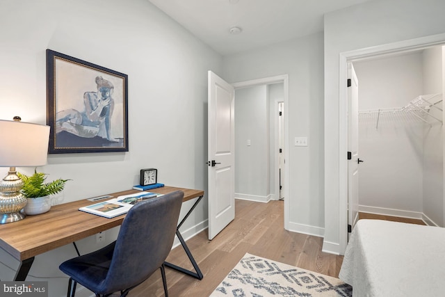 office area with light hardwood / wood-style flooring