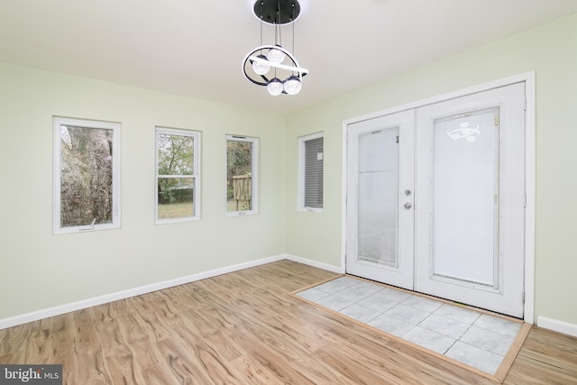 167 Shamrock Dr, Salisbury, MD 21804 - foyer with light wood-style flooring, baseboards, a chandelier, and french doors