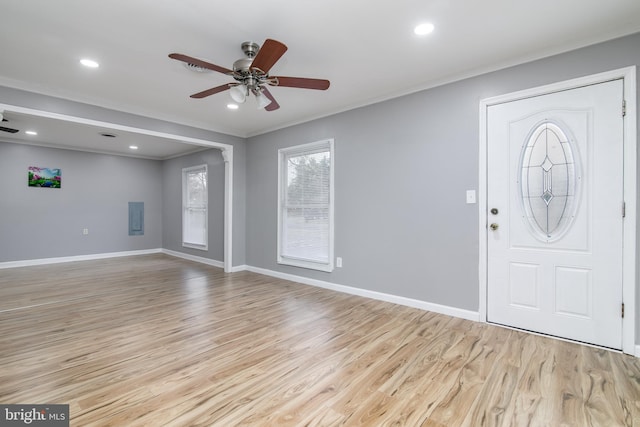 entryway featuring light hardwood / wood-style floors, ceiling fan, and crown molding