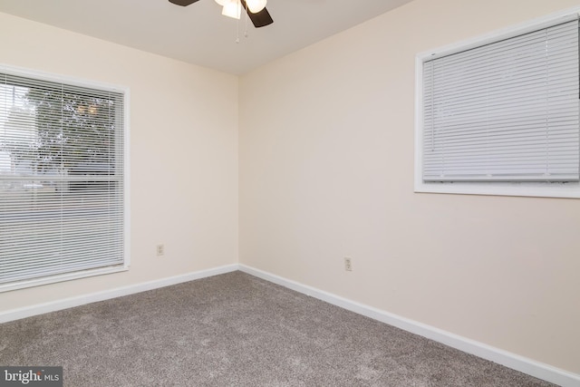 carpeted empty room with ceiling fan